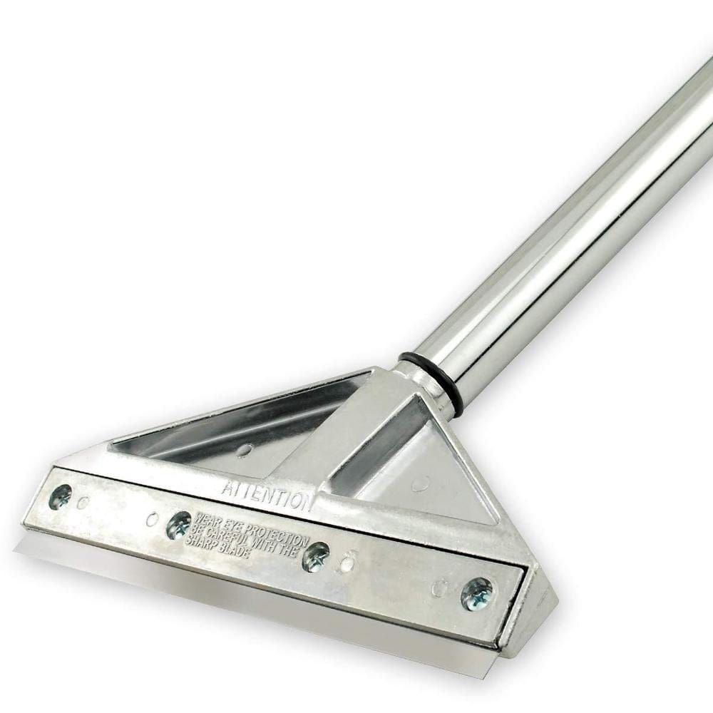 Detailed angled view of the die-cast metal scraper head holding the blade securely with four screws. Stamped text on the metal head reads "ATTENTION WEAR EYE PROTECTION BE CAREFUL WITH THE SHARP BLADE".
