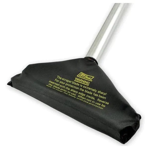 Close-up of the floor scraper head enclosed in a black nylon safety cover. Yellow printed text on the cover reads "WARNING The scraper blade is extremely sharp! For your protection the blade has been inserted with the sharp edge inside."