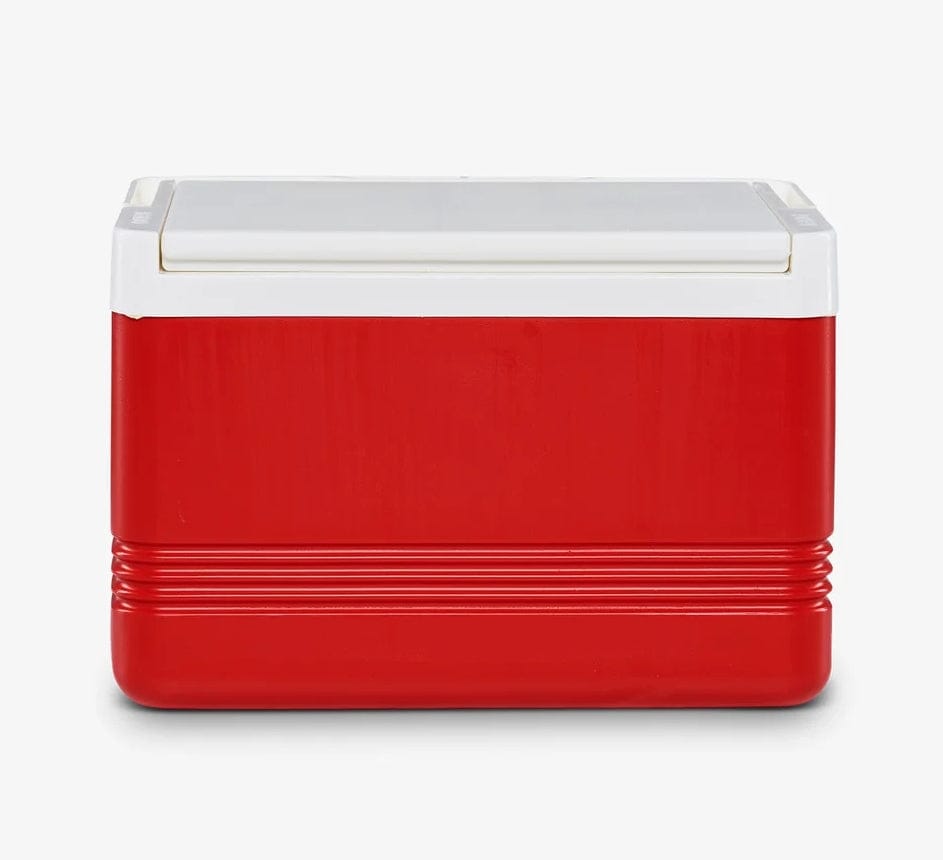 Red and white Igloo Legend personal cooler with horizontal ridges near the base. Compact rectangular design with white lid, suitable for portable cold storage.