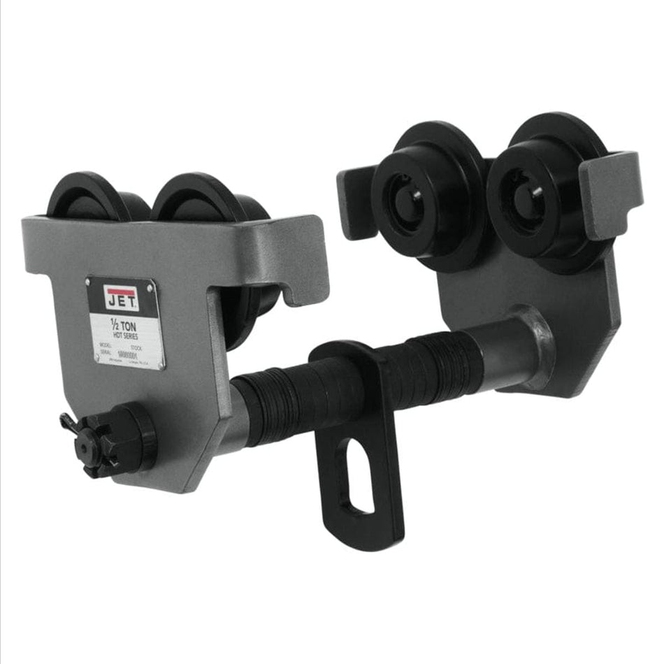 Studio angle view of the grey Jet 1/2-HDT manual beam trolley featuring four black wheels, a threaded adjustable width crossbar with washers, and a distinct lower hanging eyelet for lifting attachments
