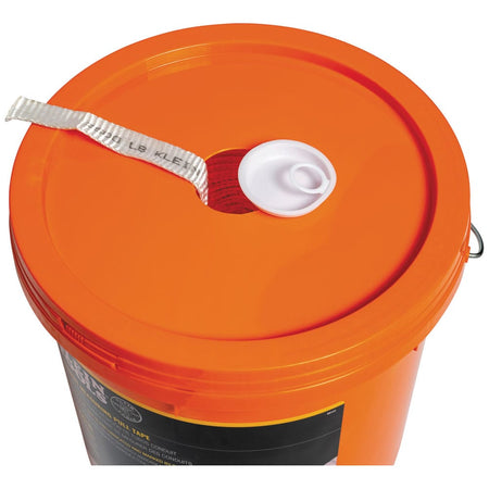 Top-down view of the Klein 50141 orange bucket lid showing the white cap removed from the center hole for pre-lubricated tape feed.