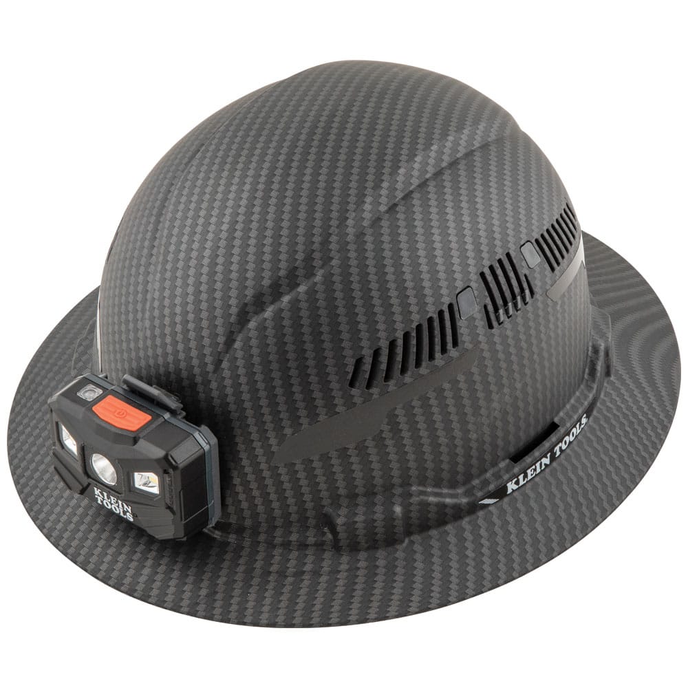 Klein Tools 60347 Class C vented full brim hard hat in KARBN pattern featuring adjustable side vents and a mounted LED headlamp.