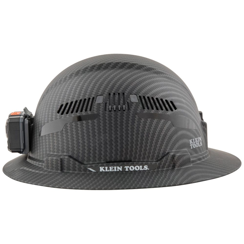 Side profile view of the Klein Tools KARBN Class C hard hat showing full brim sun protection and secure headlamp attachment.