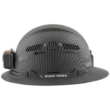 Side profile view of the Klein Tools KARBN Class C hard hat showing full brim sun protection and secure headlamp attachment.