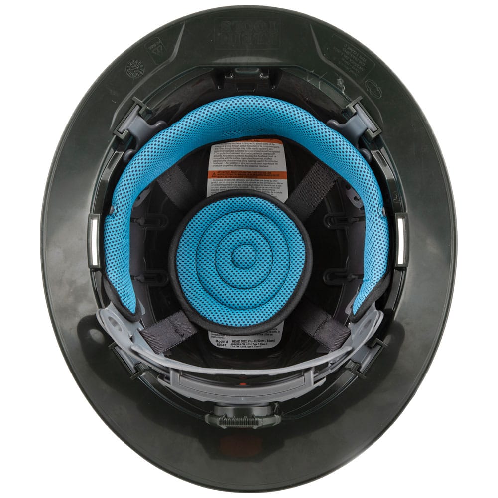 Bottom view showing the interior 4-point ratchet suspension frame with blue machine-washable padding in a Klein Tools hard hat.