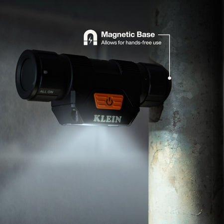Detachable Klein Tools 56078 headlamp body using its strong end-cap magnetic base to mount horizontally onto a steel pipe.