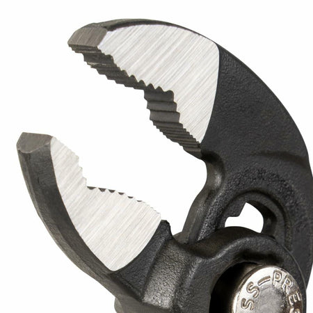 Close-up of the opened jaws of the Klein Quick-Adjust Klaw Pump Pliers, clearly showing the V-Jaw design and the hardened, sharp gripping teeth.