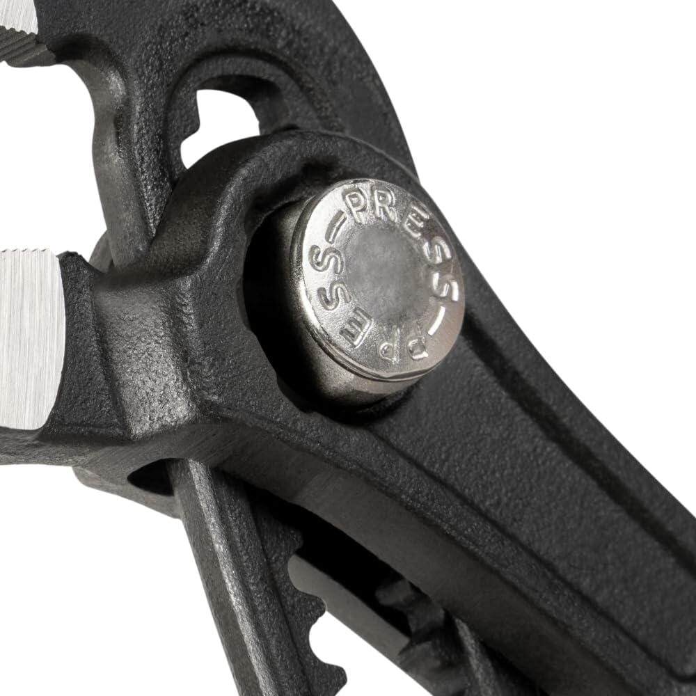 Extreme close-up of the Quick-Adjust button and rivet assembly on the Klein Klaw Pump Pliers, showing the word 'PRESS' on the silver button.