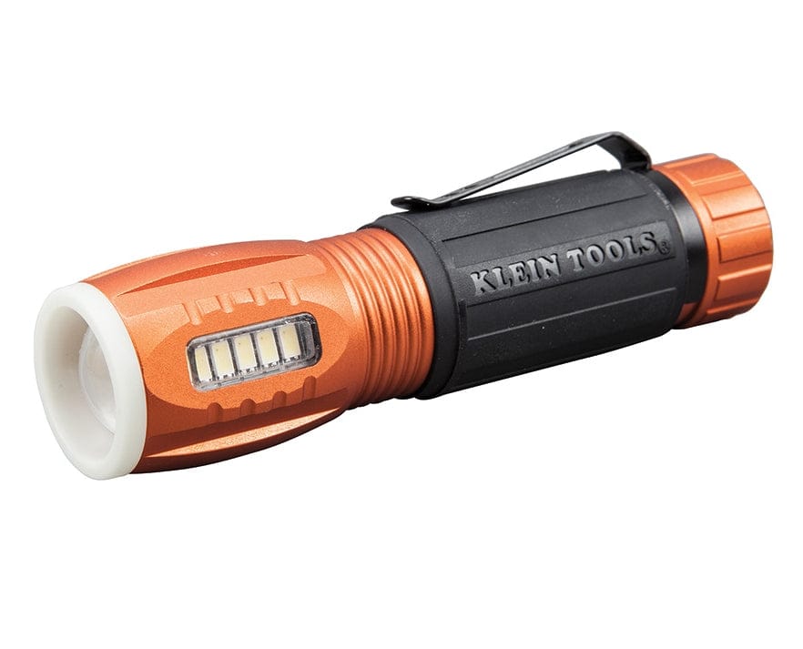 A three-quarter studio profile of the Klein 56028 LED flashlight, showing the main light, side work light, and pocket clip.