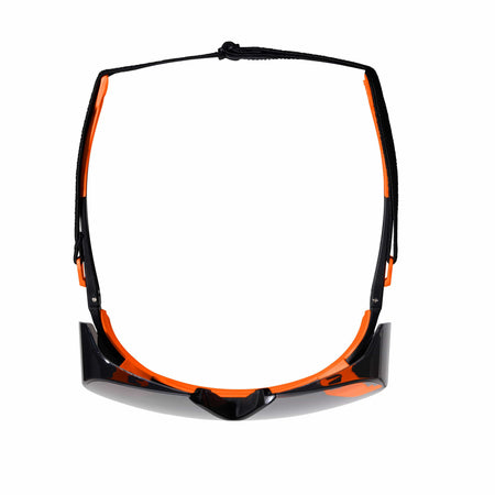 Overhead view of the shaded OTG safety eyewear with the adjustable black security strap attached to the stems, illustrating the wrap-around protection and secure head retention design.