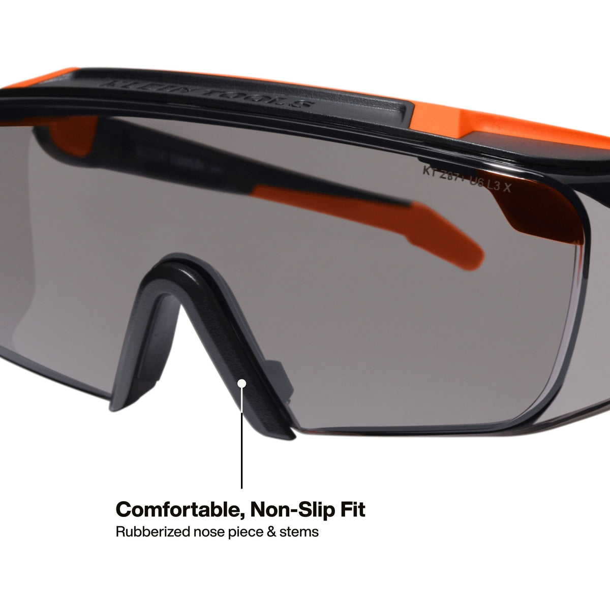 Macro perspective detail of the interior of the safety eyewear showing the comfortable rubberized nose piece and stems designed for a secure, non-slip fit during high-activity tasks.