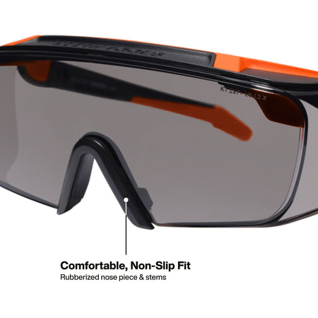 Macro perspective detail of the interior of the safety eyewear showing the comfortable rubberized nose piece and stems designed for a secure, non-slip fit during high-activity tasks.