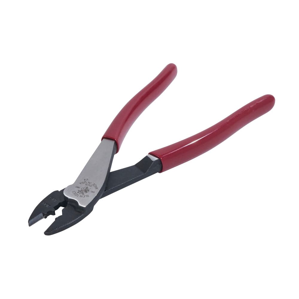 An isometric studio view of the Klein 1005 crimping and cutting tool, showing the precision-ground tapered nose and the ergonomic red cushioned handles used for secure electrical connections.