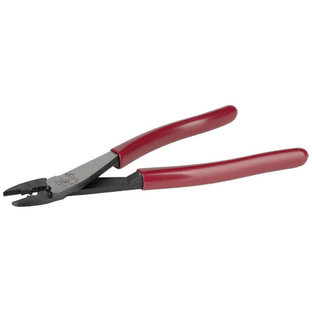 A low-angle view of the open Klein 1005 crimping tool, showcasing the hardened steel cutting blades in the nose and the tapered head design optimized for working in confined electrical spaces.