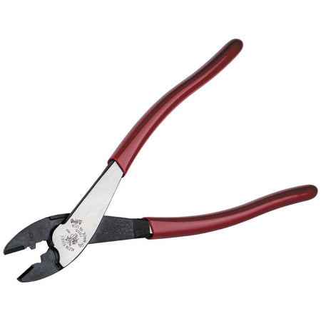 A professional product view of the Klein 1005 crimper and cutter oriented diagonally, highlighting the high-visibility red handles and the precision-machined steel head.