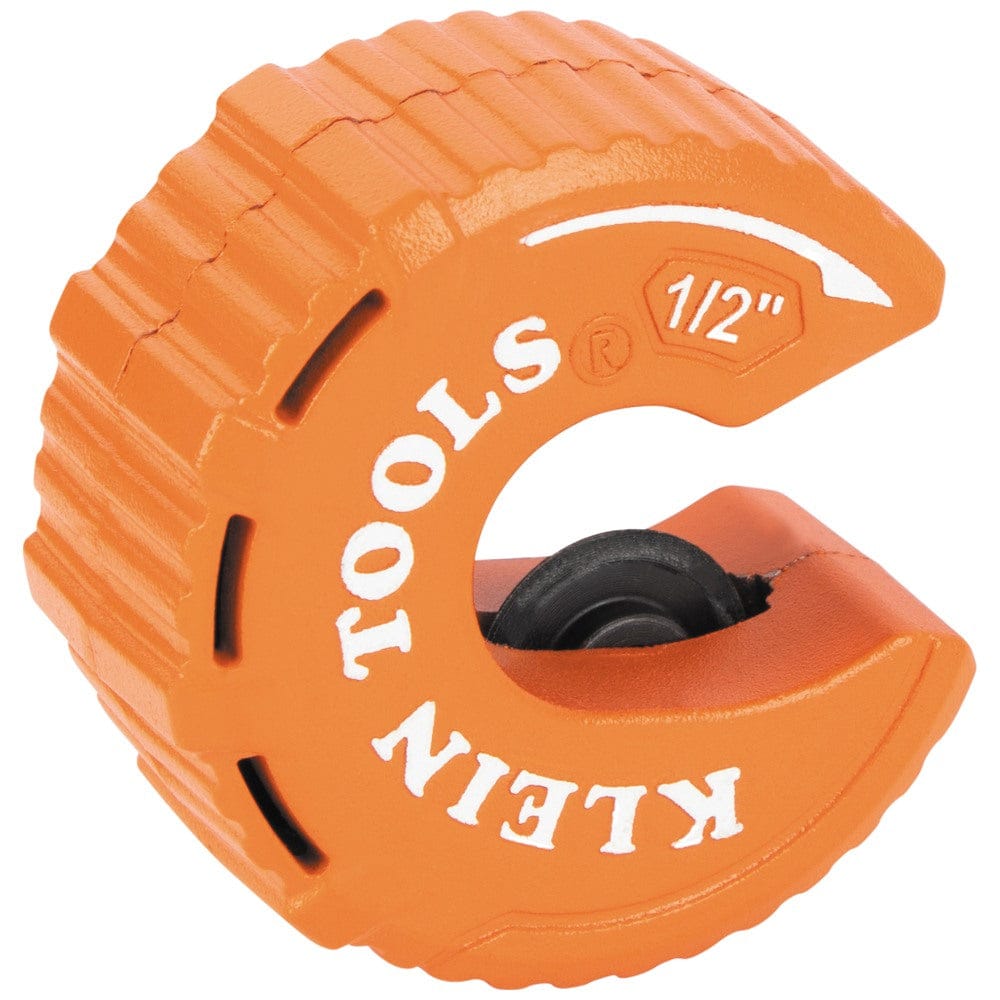 A three-quarter perspective view of the Klein Tools 1/2 inch copper pipe cutter, highlighting the ribbed outer surface for enhanced grip. The internal cutting wheel and rollers are positioned to provide high-precision cuts for HVAC and plumbing applications.