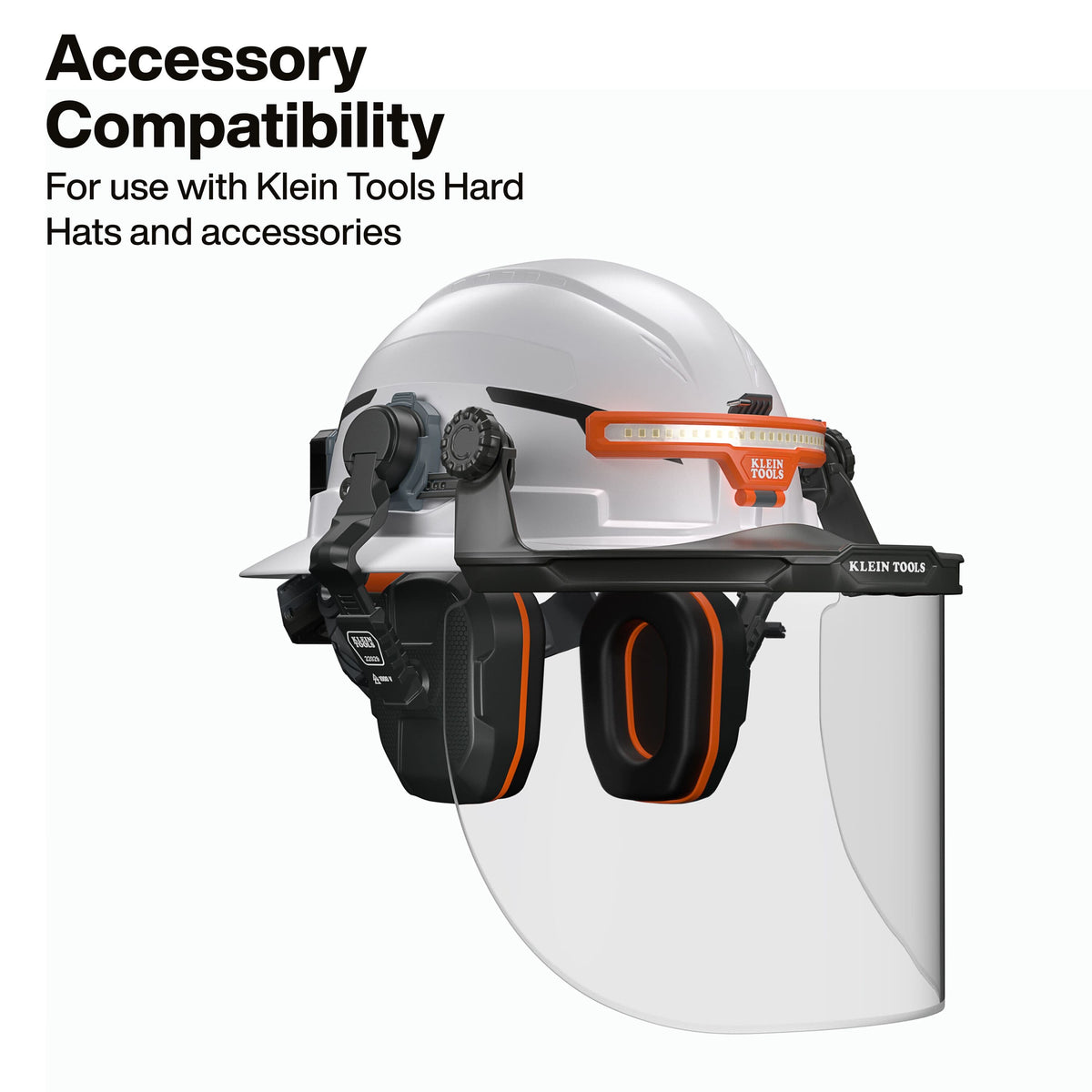 Full accessory compatibility demonstration showing the 22029 earmuffs integrated onto a hard hat along with a Klein Tools headlamp and a clear protective face shield for total head and face protection.