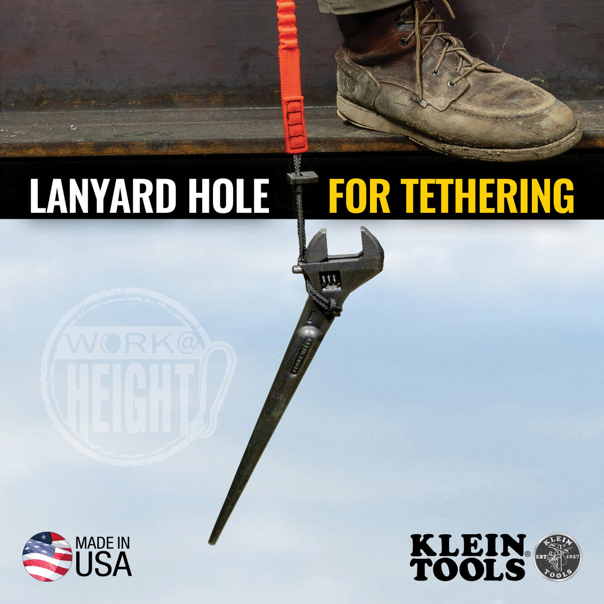 Klein Tools 3227 Adjustable Construction Spud Wrench tethered by lanyard during elevated work, showing tapered handle and tether hole for dropped‑tool prevention in work‑at‑height environments.