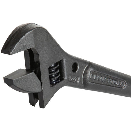Close‑up of a Klein Tools 3227 Adjustable Spud Wrench with movable jaw and alloy steel body, designed for tightening heavy‑duty fasteners and aligning bolt holes in construction applications.