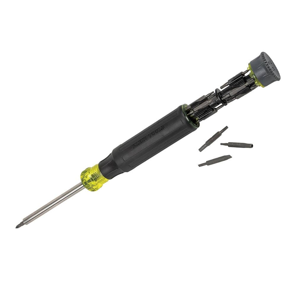 Angled studio view of the Klein Tools 27-in-1 multi-bit screwdriver featuring a black cushion-grip handle, yellow accents, and a grey bit storage end cap.
