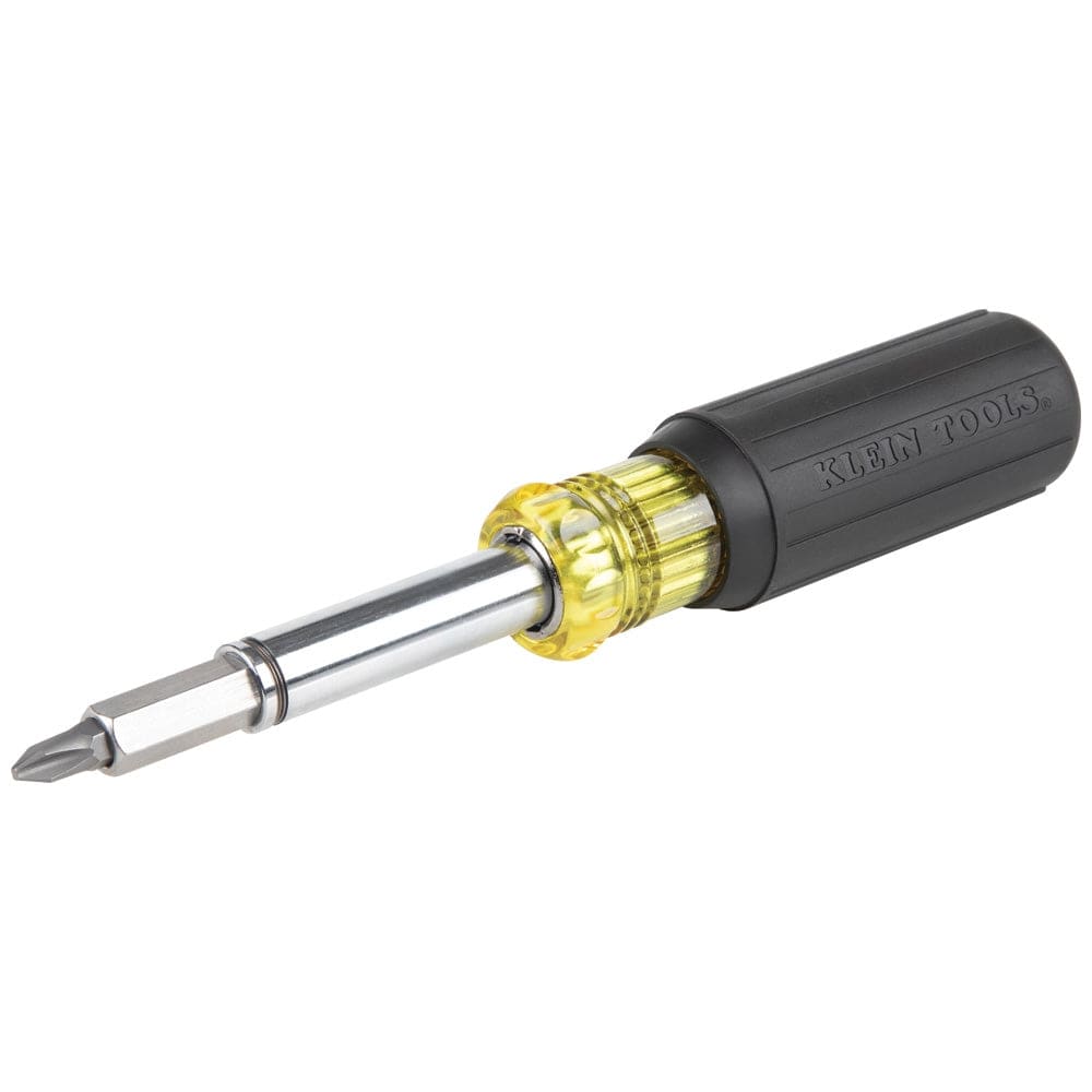 An angled profile view of the Klein Tools 11-in-1 magnetic multi-bit screwdriver, showcasing the iconic yellow and black cushion-grip handle and the chrome-plated interchangeable shaft with a bit installed.