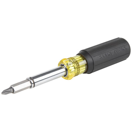 An angled profile view of the Klein Tools 11-in-1 magnetic multi-bit screwdriver, showcasing the iconic yellow and black cushion-grip handle and the chrome-plated interchangeable shaft with a bit installed.