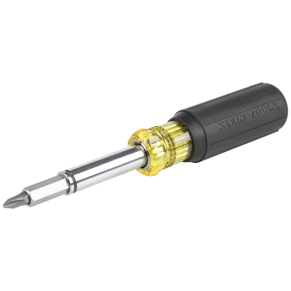 An angled profile view of the Klein Tools 11-in-1 magnetic multi-bit screwdriver, showcasing the iconic yellow and black cushion-grip handle and the chrome-plated interchangeable shaft with a bit installed.