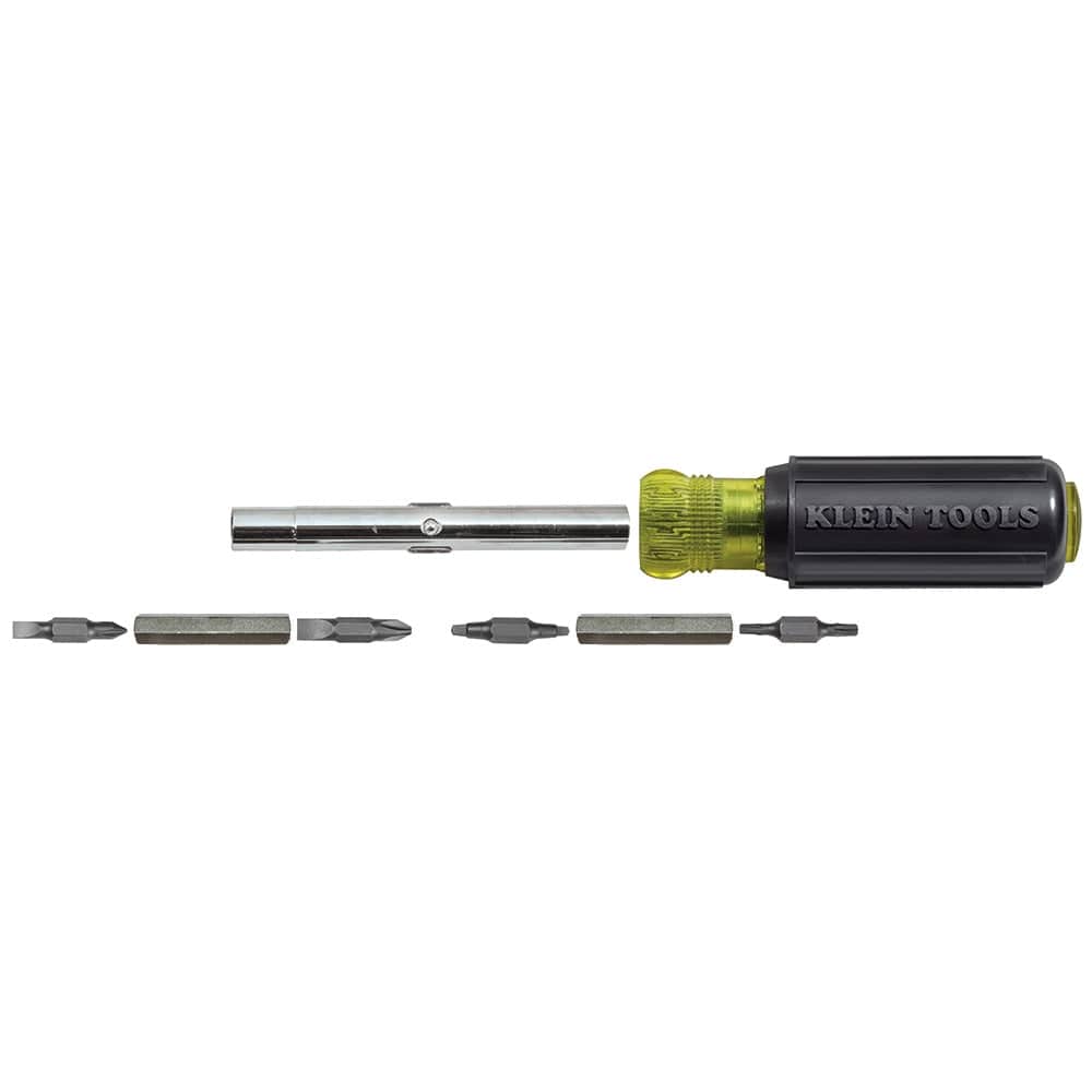 The disassembled components of the 32500 multi-tool are laid out in a row, showing the individual bits, the interchangeable nut driver shafts, and the cushioned handle.