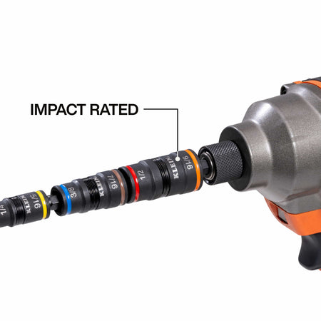 A functional demonstration of the Klein Tools impact-rated flip socket attached to a cordless impact driver, illustrating the high-torque multi-bit nut driver system in use for professional fastening.