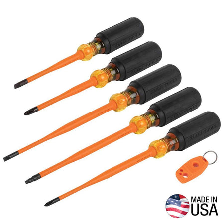 Klein Tools 33736INS 6-piece slim-tip insulated screwdriver set arranged diagonally showing five general purpose drivers with black cushion-grip handles, clear amber locking zones, and bright orange flame-resistant sheathing, pictured next to an orange magnetizer key ring accessory and a Made in USA logo icon.