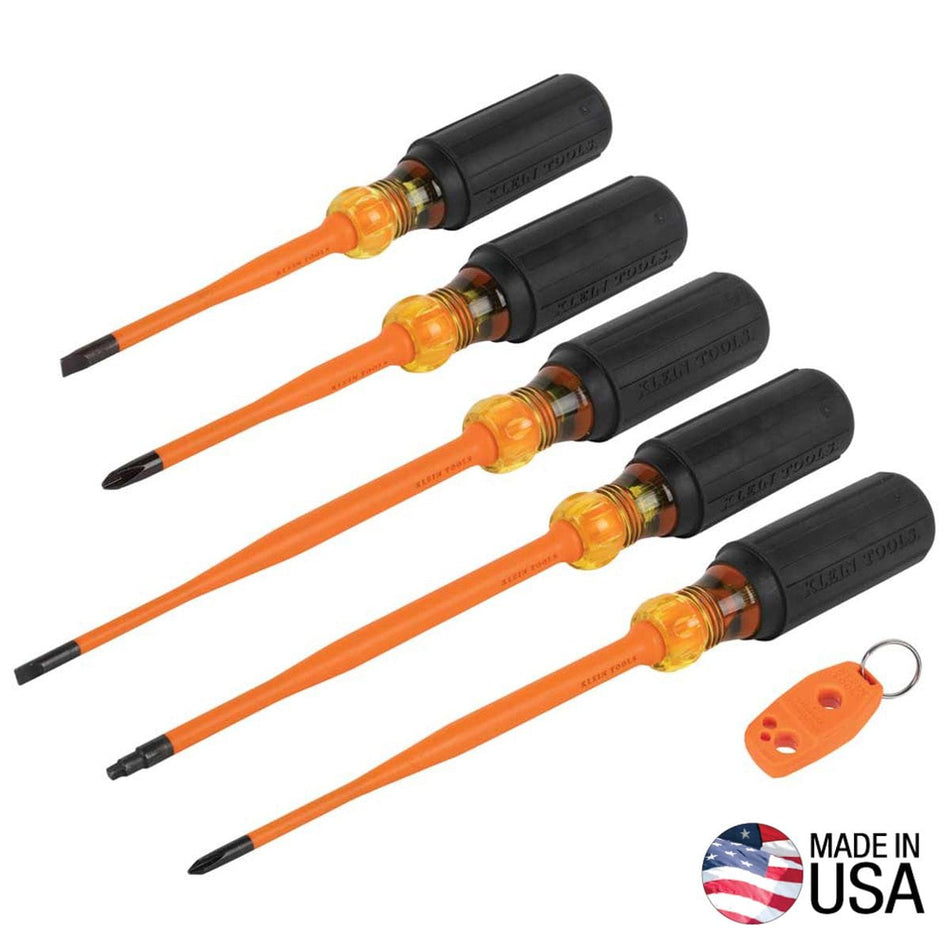 Klein Tools 33736INS 6-piece slim-tip insulated screwdriver set arranged diagonally showing five general purpose drivers with black cushion-grip handles, clear amber locking zones, and bright orange flame-resistant sheathing, pictured next to an orange magnetizer key ring accessory and a Made in USA logo icon.