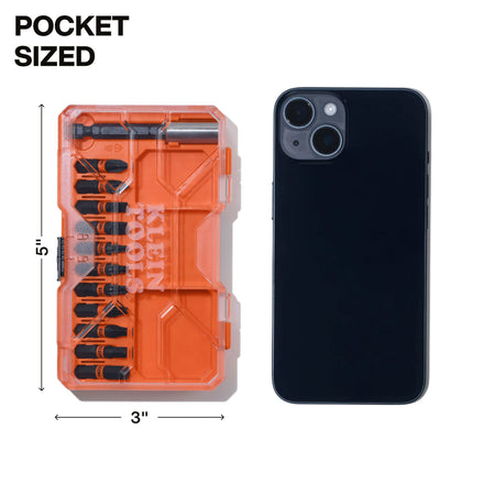 A size comparison image showing the 5-inch by 3-inch pocket-sized Klein bit case next to a modern smartphone, illustrating its portable design that fits easily into tool pouches or pockets.