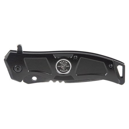 Klein Tools bearing-assisted pocket knife shown completely folded in the closed position on a white background, displaying the rugged black anodized aluminum handle scale profile, integrated frame lock boundary line, secure flush-mount pivot screw, lanyard tether hole, and the classic round company emblem.