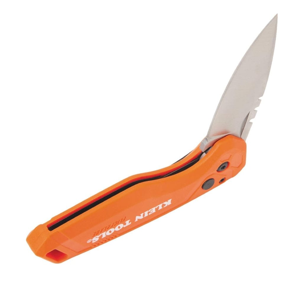 Angled top-down view of the open knife showing the spine of the orange handle and the button lock for the blade.