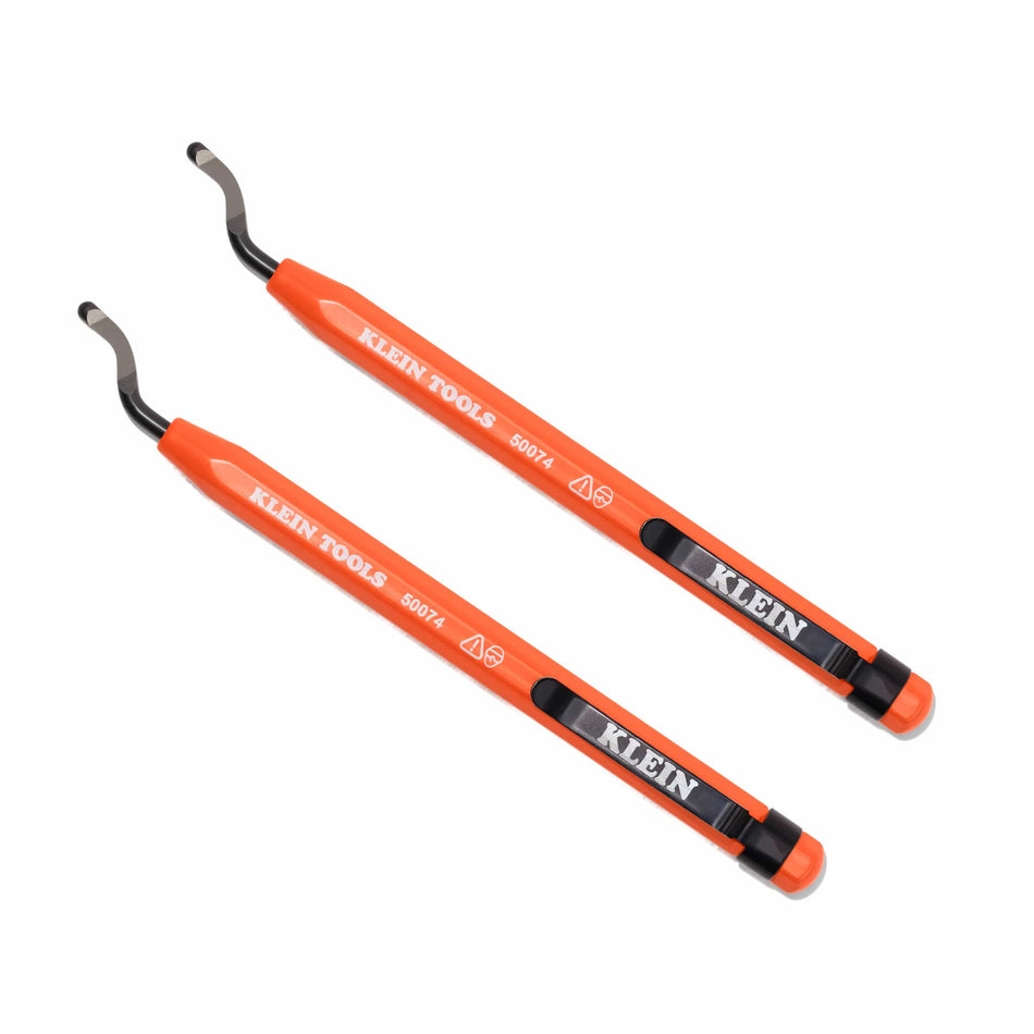 A 2-piece set of Klein Tools 50074 reaming pens featuring high-visibility orange bodies, black pocket clips, and curved free-spinning deburring blades for pipe preparation.