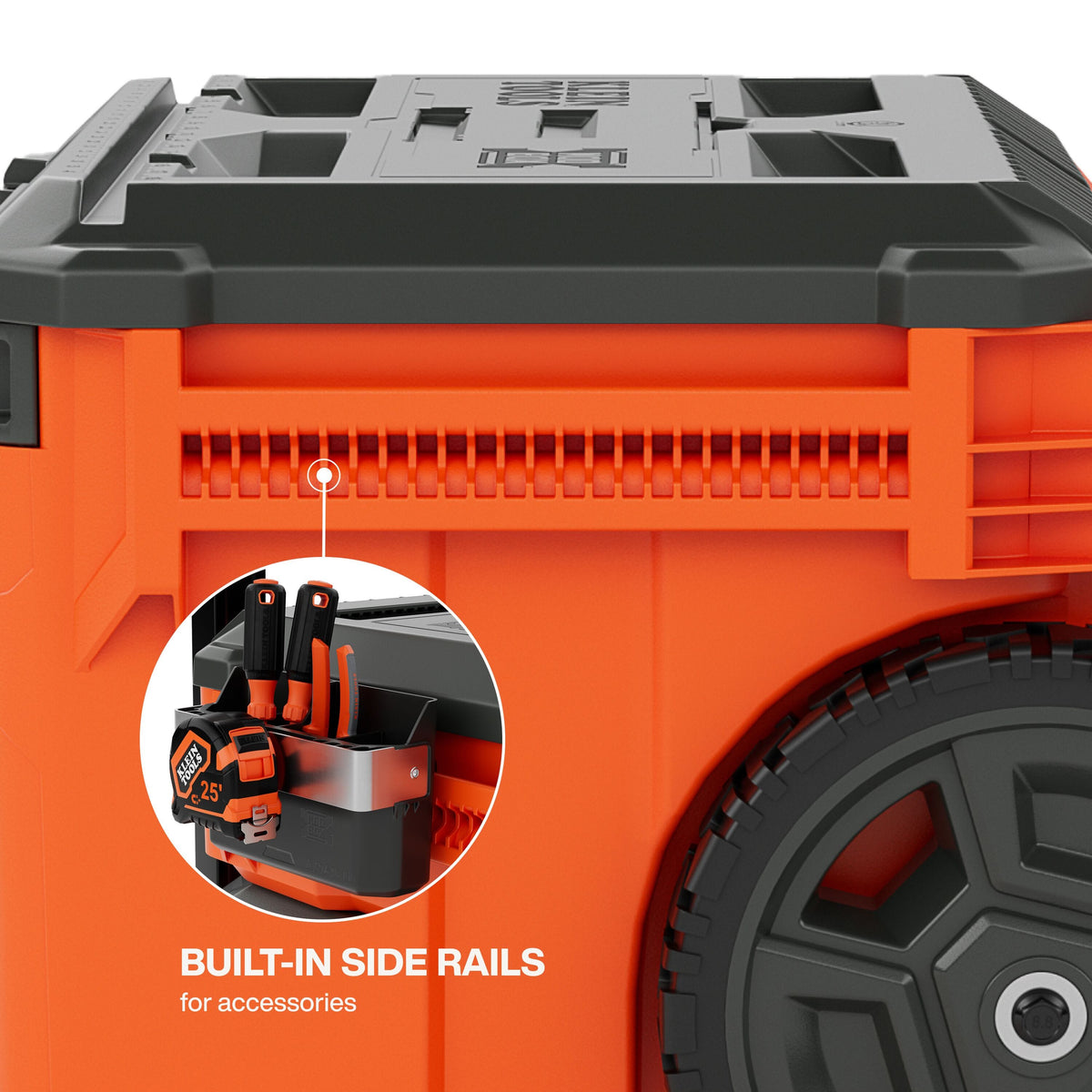 Close-up of the MODbox side rail system demonstrating how to attach modular accessories like a tool cup or tape measure holder for quick access on the jobsite.