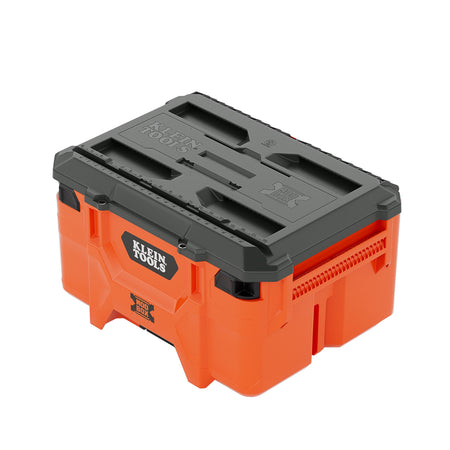 Side perspective view of the orange Klein Tools 54200MBX MODbox medium toolbox featuring a dark grey workstation lid with integrated measuring ruler and reinforced side handles.