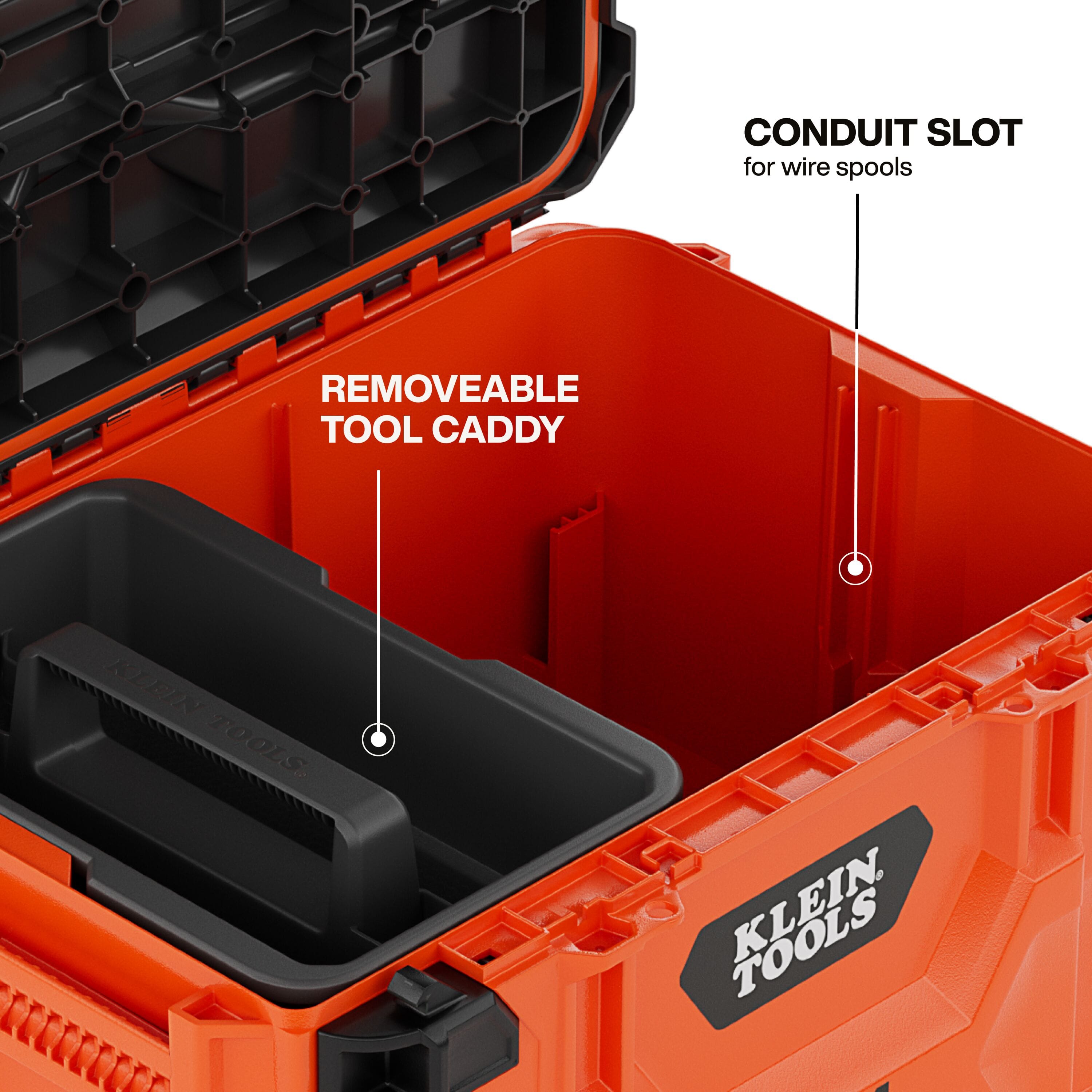 Interior detail shot of the Klein Tools 54200MBX highlighting the integrated conduit slot for wire spools and the removable tool caddy for organized hand tool access.