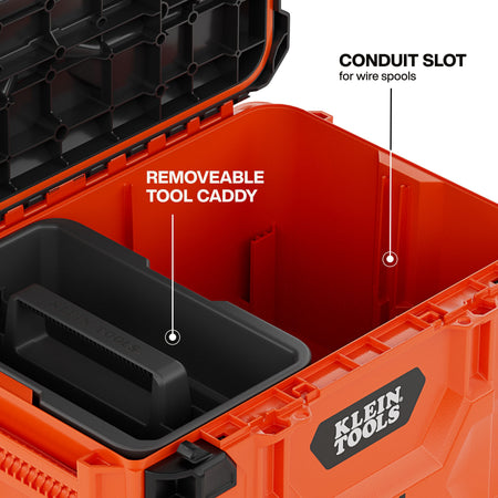 Interior detail shot of the Klein Tools 54200MBX highlighting the integrated conduit slot for wire spools and the removable tool caddy for organized hand tool access.