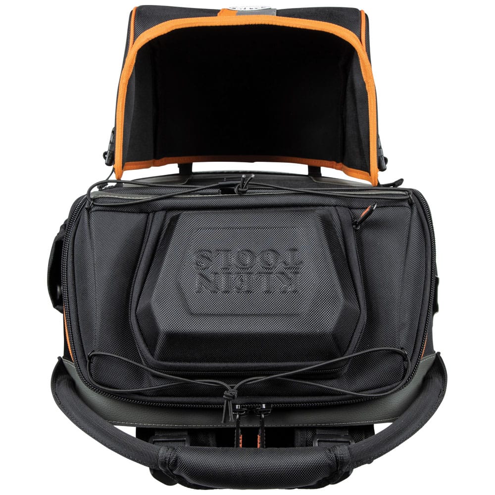 A top studio view of the Ironworker and Welder backpack. This angle showcases the heavy-duty aircraft cable reinforced handle and the hard-shell top compartment designed to protect sensitive electronics and safety glasses from crushing or impact.