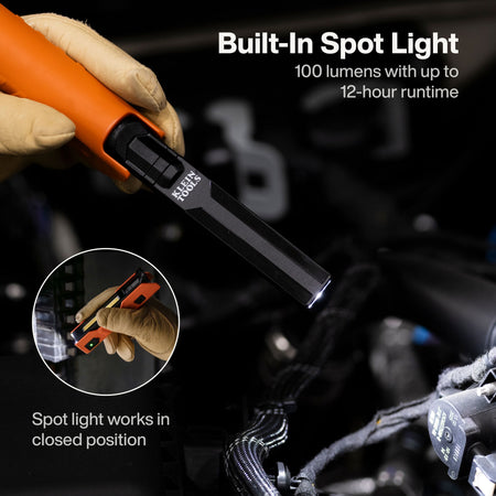 Close-up view of the 100-lumen built-in spotlight functioning while the tool is in a closed position, ideal for precision inspection work in tight mechanical spaces.