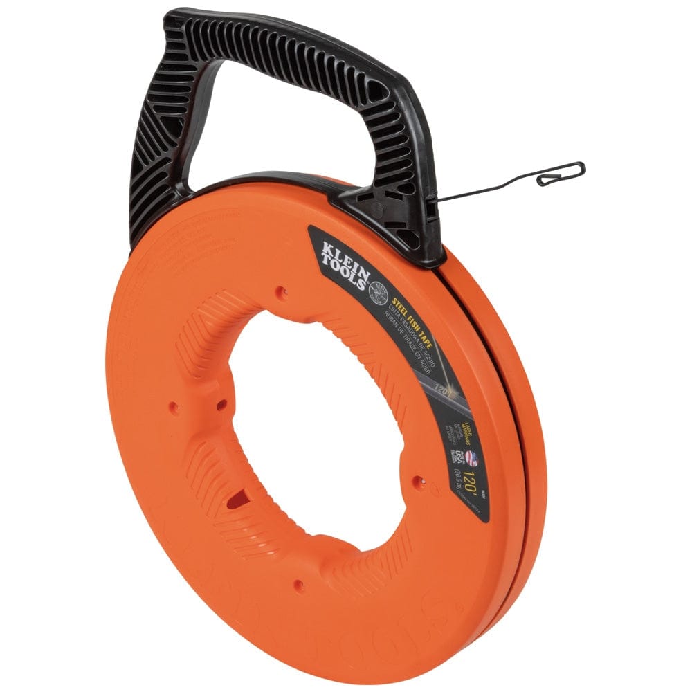 Angled studio view of the bright orange circular fish tape reel featuring a black multi-position handle and the steel tape end extending out.