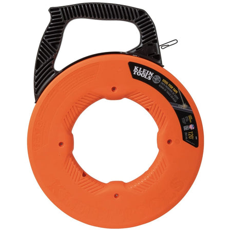 Front-facing studio shot of the orange Klein Tools 120-foot steel fish tape reel showing the central hand-hold and black handle.
