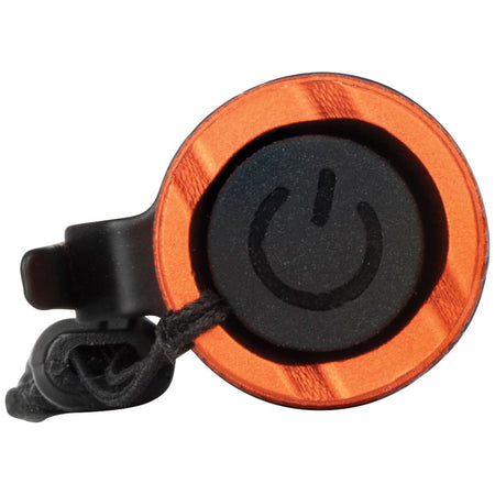 An end-cap view of the flashlight focusing on the ergonomic textured power button, designed for easy cycling through the High, Medium, Eco, and Strobe lighting modes even while wearing work gloves.