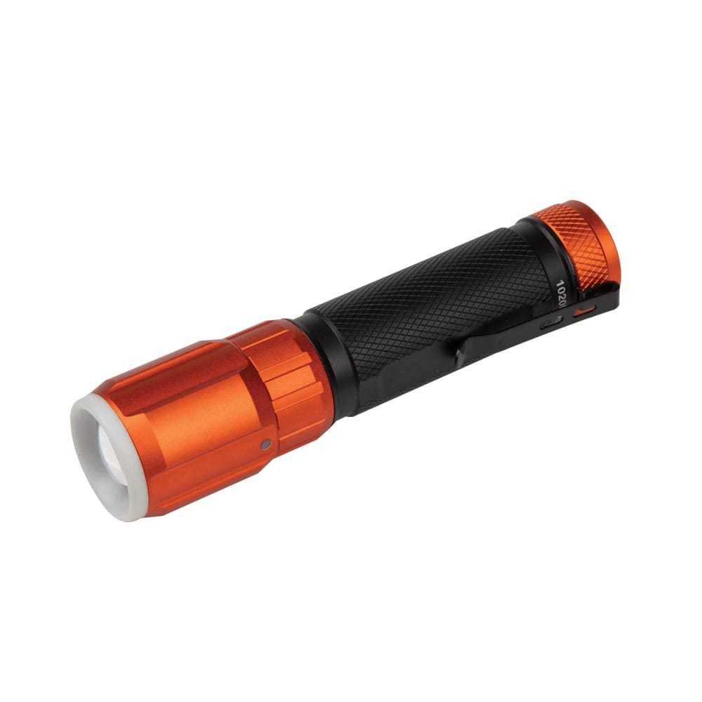 Angled rear view of the Klein Tools 56412 IP66 water and dust proof daily job site flashlight, highlighting the textured knurled grip and sturdy removable pocket clip.