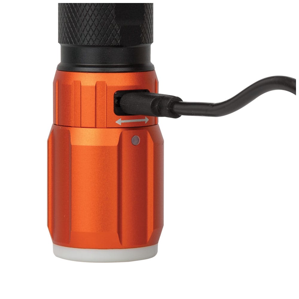 Close-up of the Klein Tools 56412 flashlight collar twisted open to expose the protected USB-C charging port with the charging cable plugged into the device.