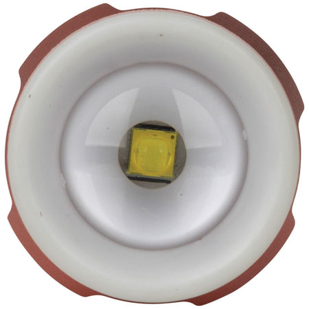 Close-up of the front lens on the Klein 56412 LED flashlight, displaying the primary LED bulb surrounded by the luminescent glow ring locator bezel.