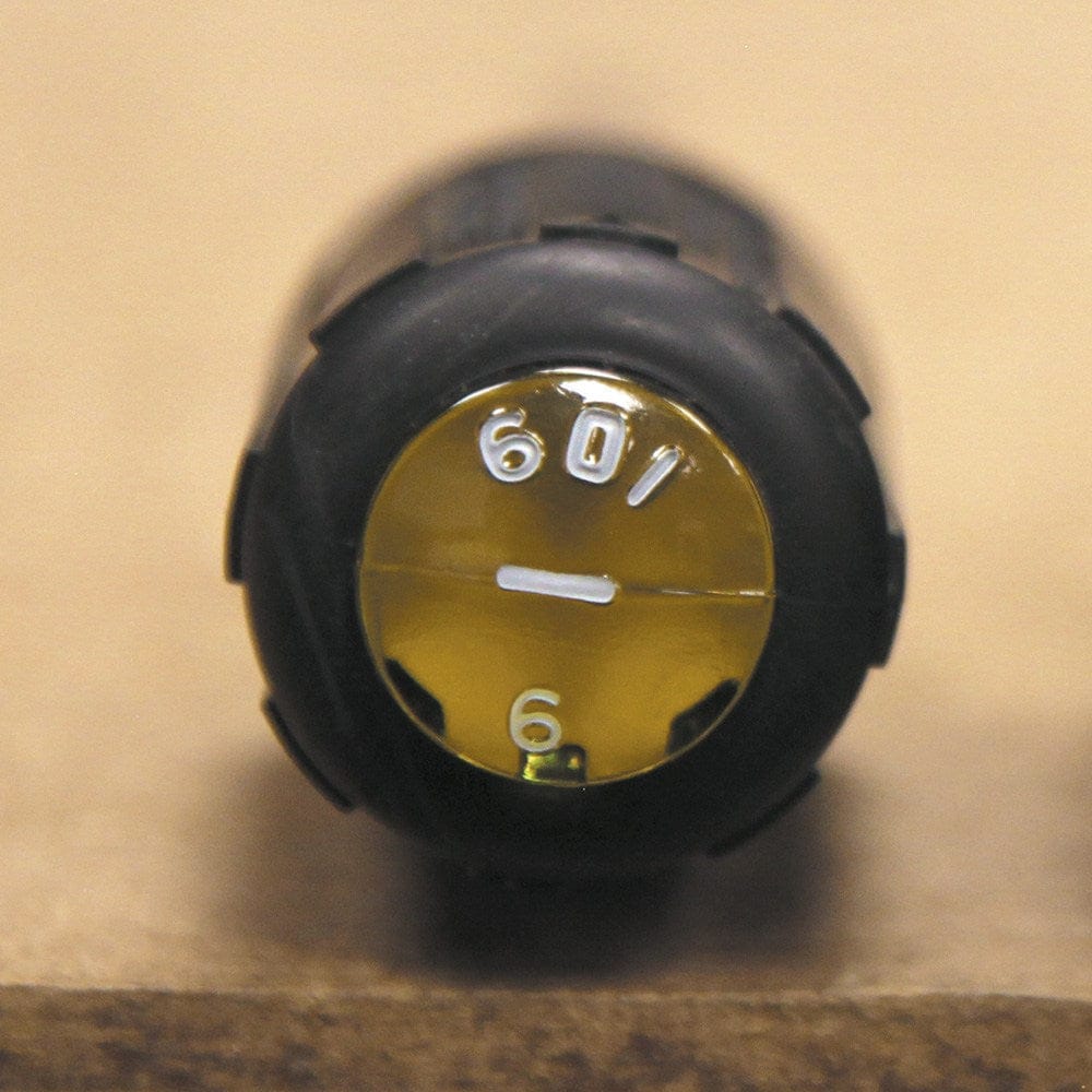 A close-up view of the handle end of a Klein Tools screwdriver showing the yellow Tip-Ident orientation mark with 601-6 and a slotted icon for quick tool identification.