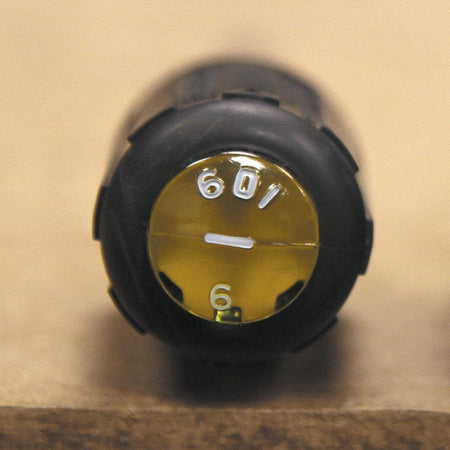 A close-up view of the handle end of a Klein Tools screwdriver showing the yellow Tip-Ident orientation mark with 601-6 and a slotted icon for quick tool identification.