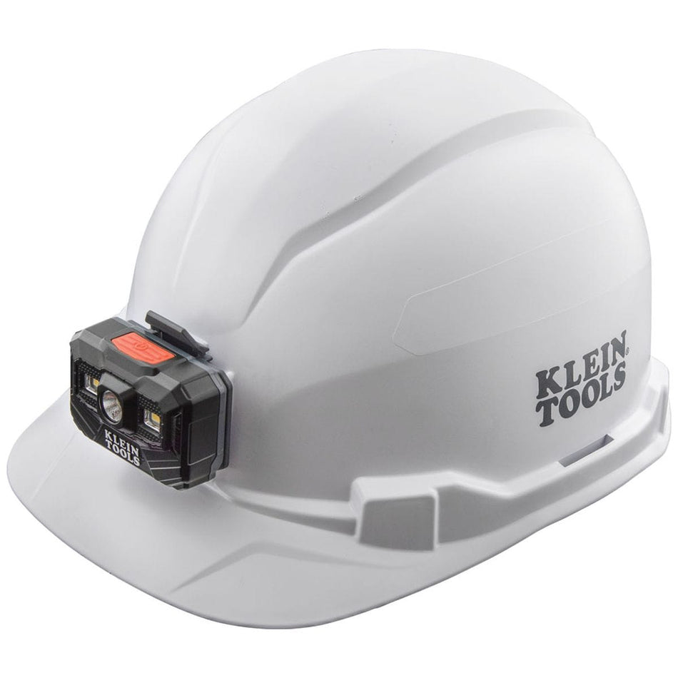 A three-quarter view of the Klein Tools 60107RL white cap-style hard hat, featuring a front-mounted, strapless rechargeable LED headlamp and the prominent Klein Tools logo on the side of the high-impact shell.